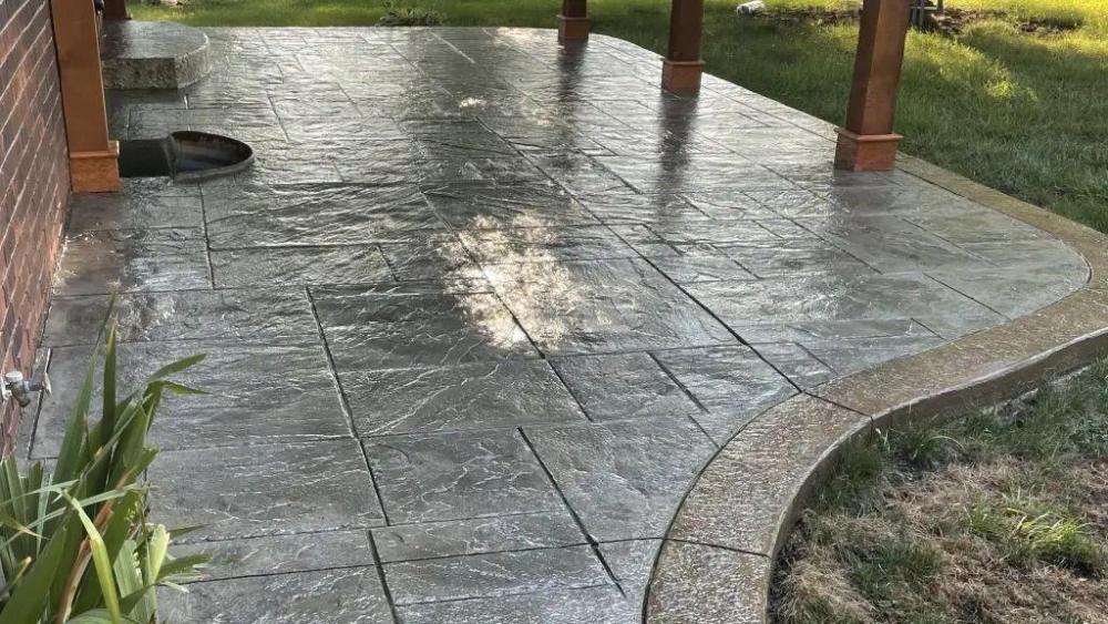 Stamped concrete patio with a wet-look finish after cleaning and sealing