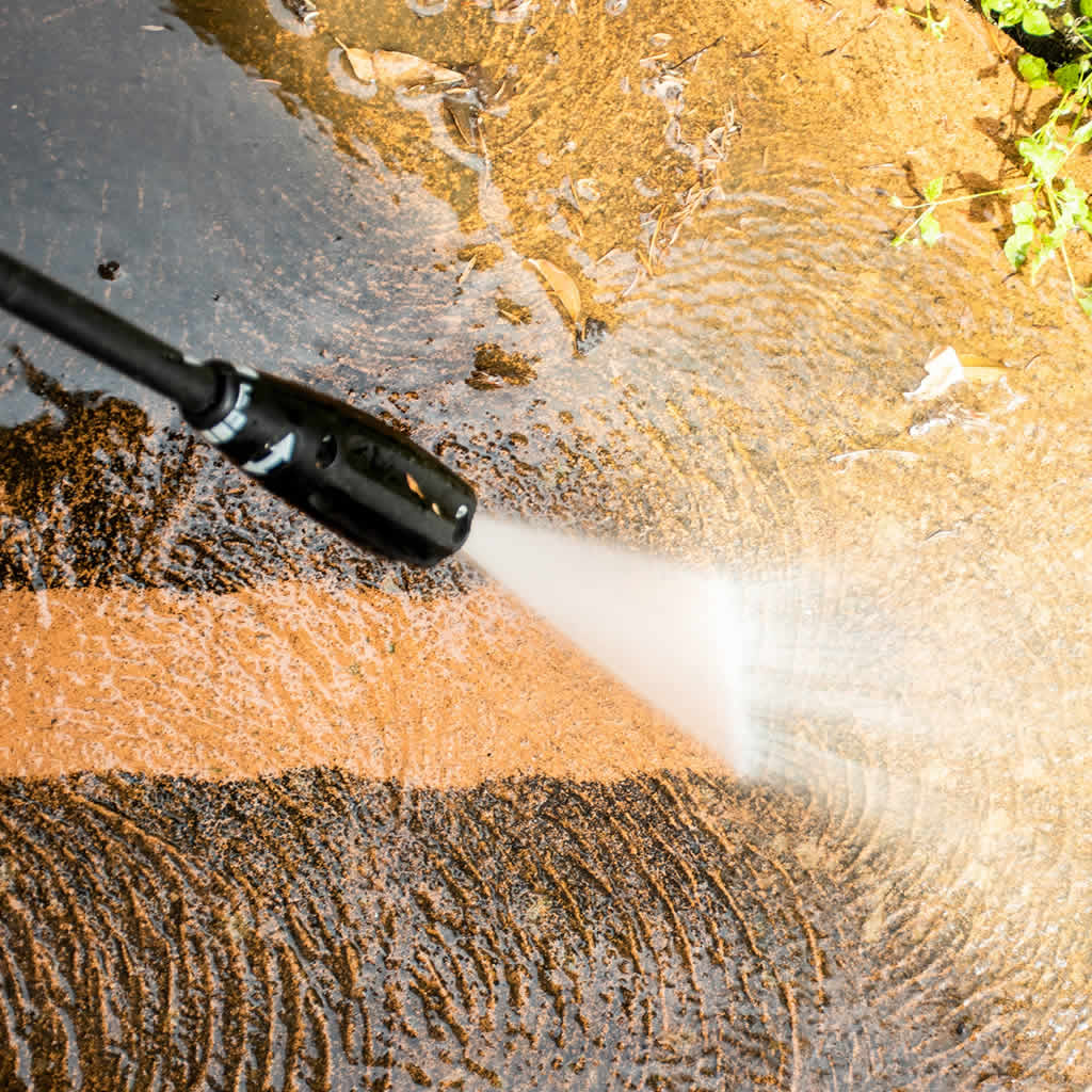 Power washing results for heavy dirt grime algae and buildup on exterior surfaces in North Carolina